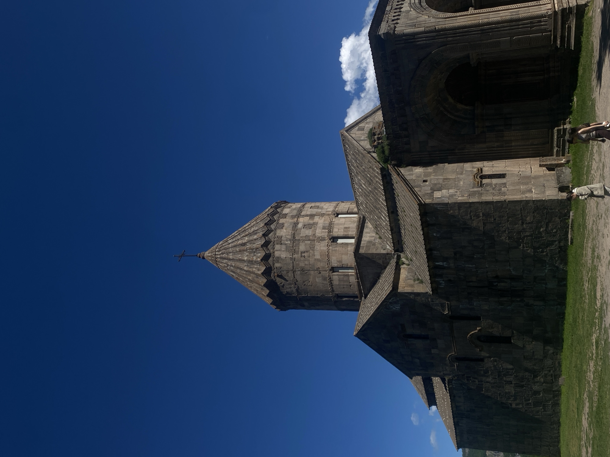 Visitor documents Tatev Monastery's architecture and religious artwork