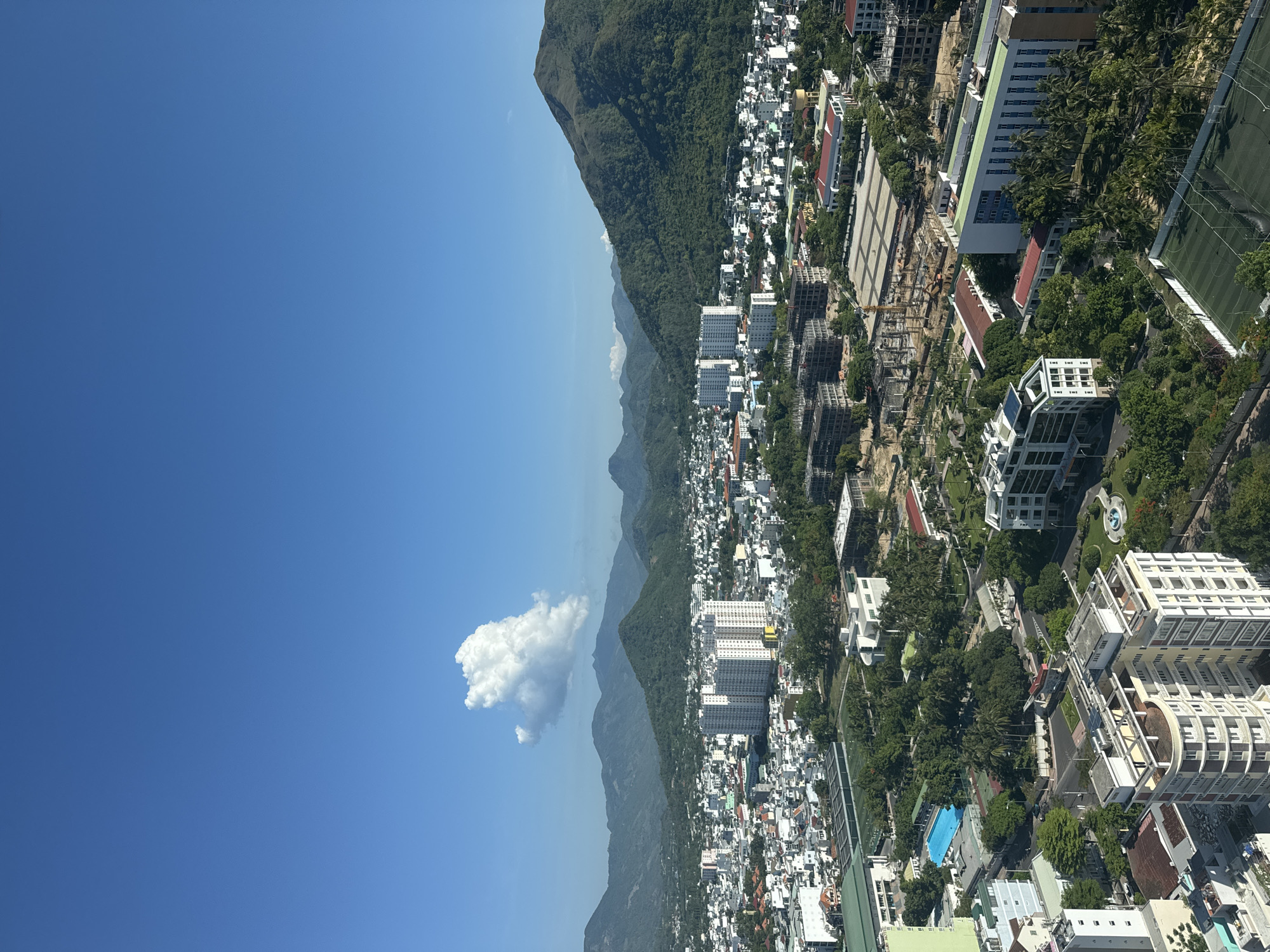 Aerial views capture coastal city skyline on clear day