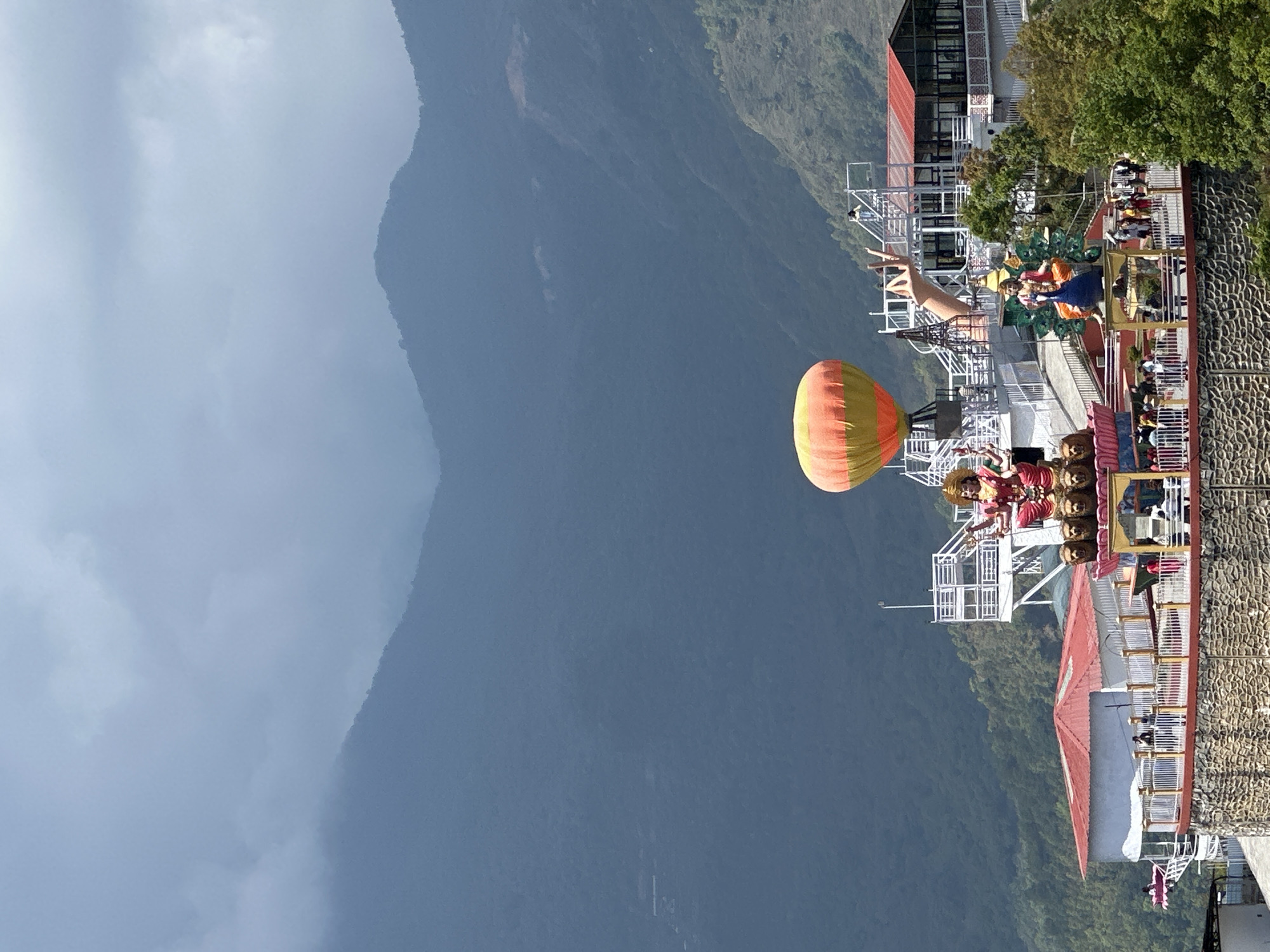 Tourist platform spotted on Pokhara hillside against mountain backdrop