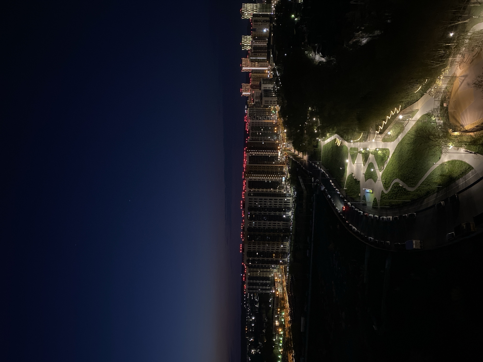 Nighttime aerial view captures illuminated Kazan cityscape