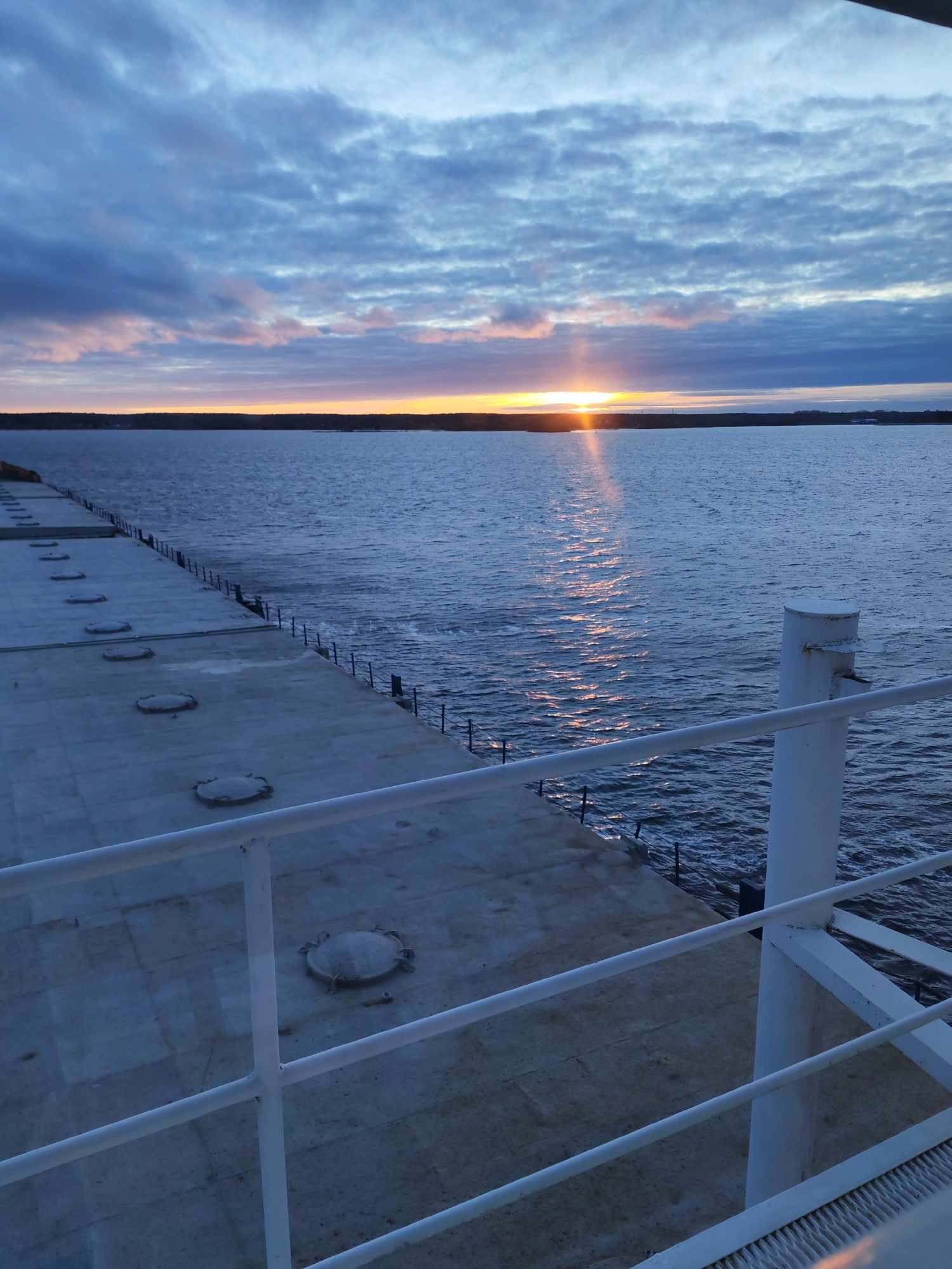 Serene sunrise captured from boat deck in Bol'shie Mkhi