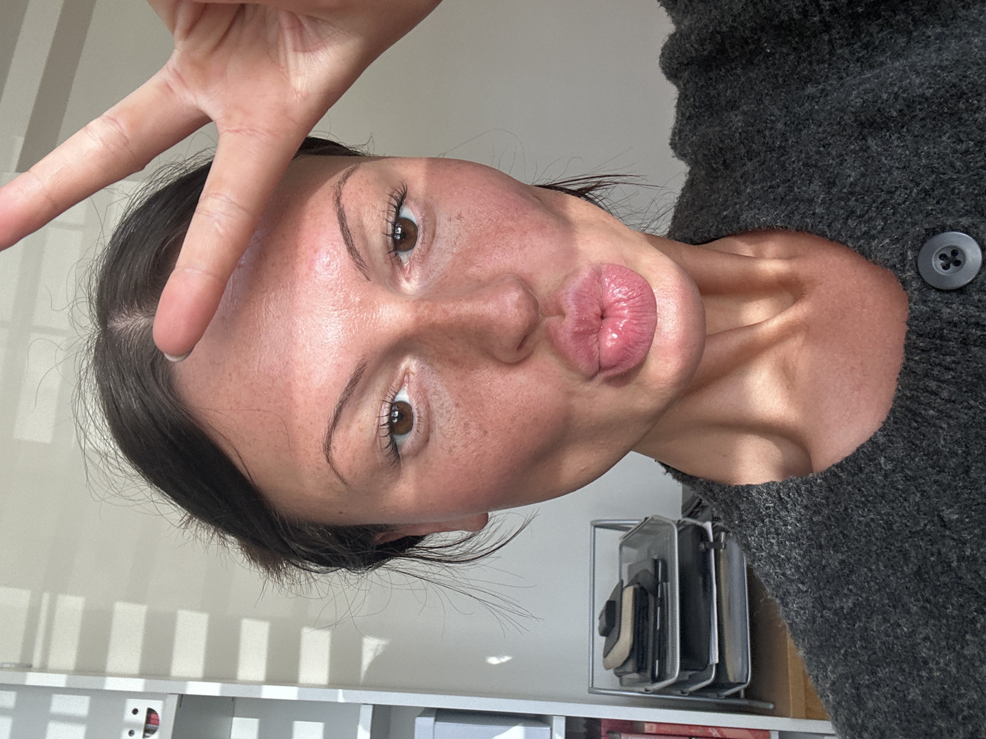 Woman takes peace sign selfie in Tunbridge Wells