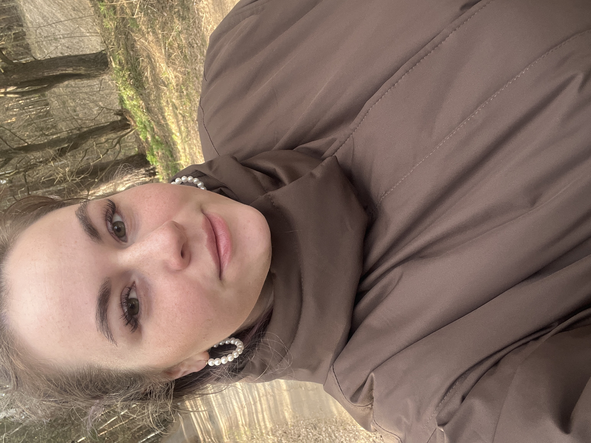 Woman takes selfies on forest road in Chaikovsky