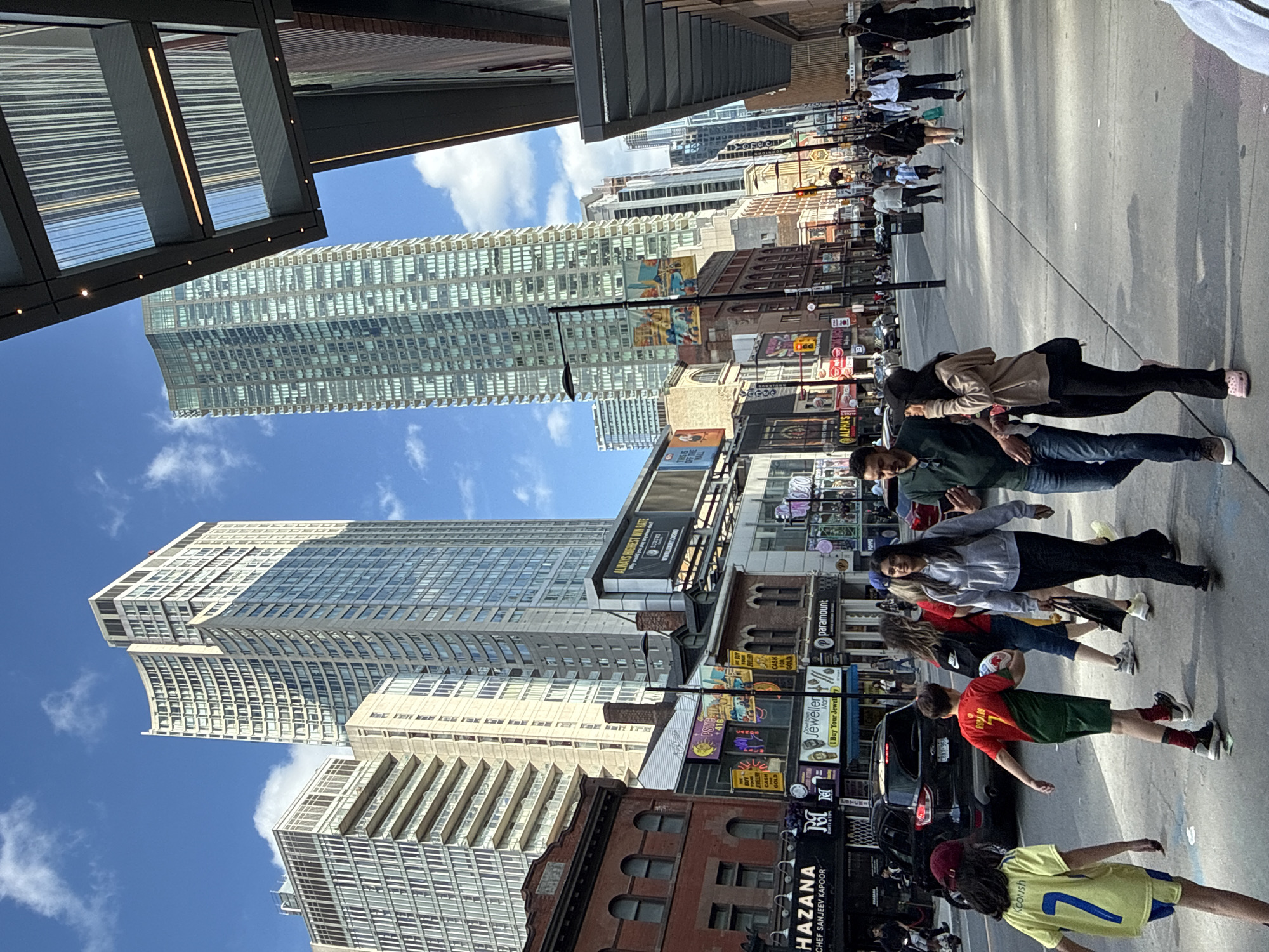 Evening street life and shopping captured across downtown Toronto