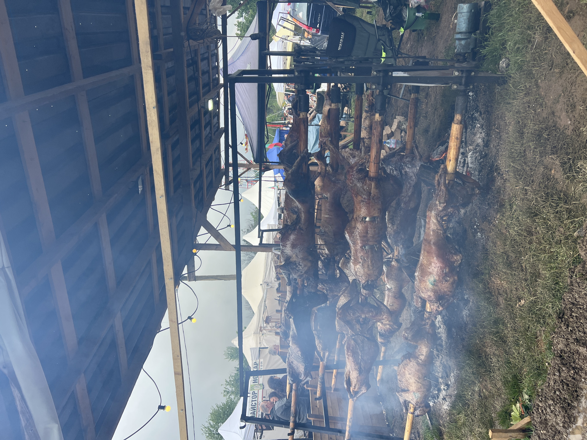 Traditional spit-roasting observed at outdoor gathering in Lyaskovets