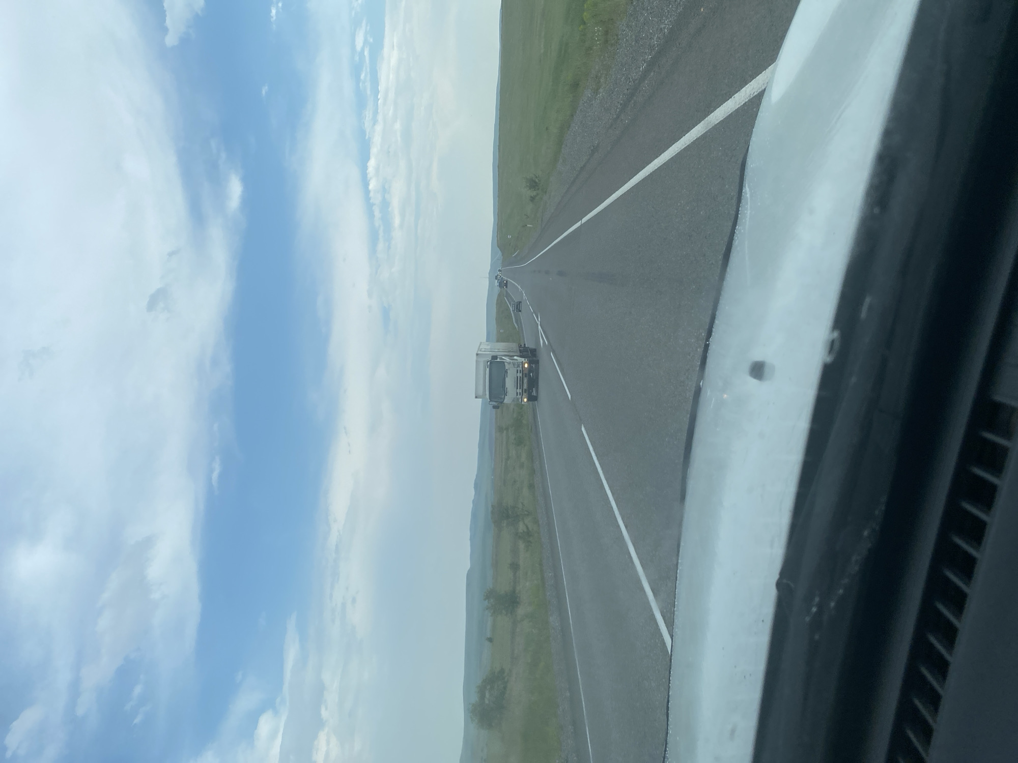 Vehicle travels wet rural roads through Krasnyi Kamen countryside