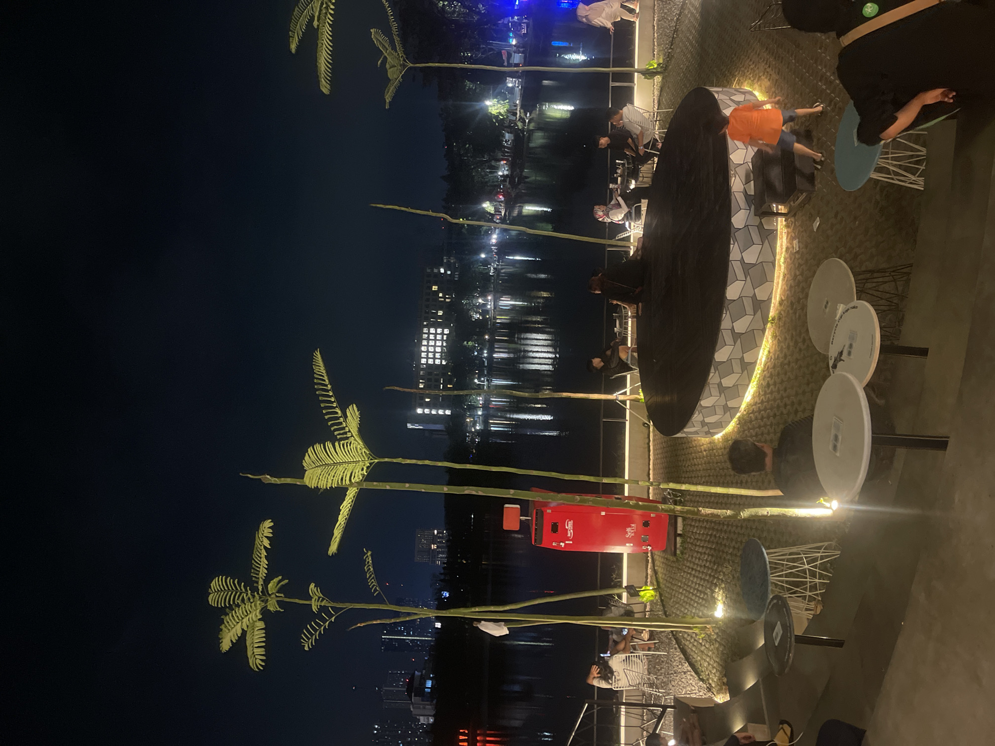 Evening at a waterfront cafe strip in Surabaya, Indonesia
