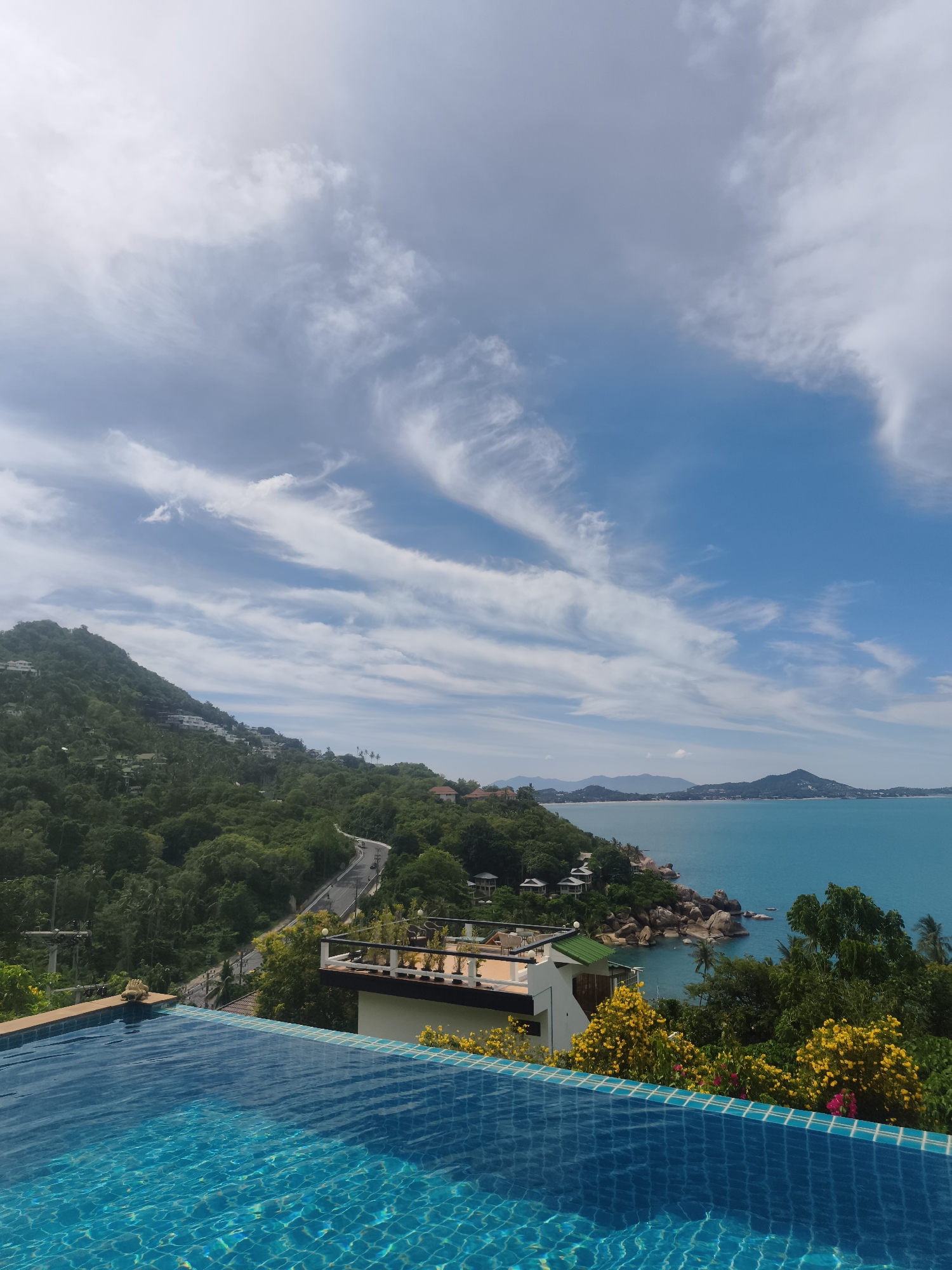 Morning poolside reading session overlooking Ko Samui coastline
