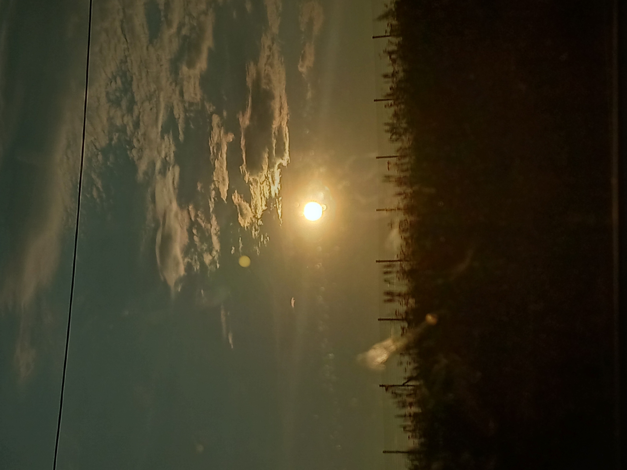 Fenced field at sunset in rural Bashkibash, Russia