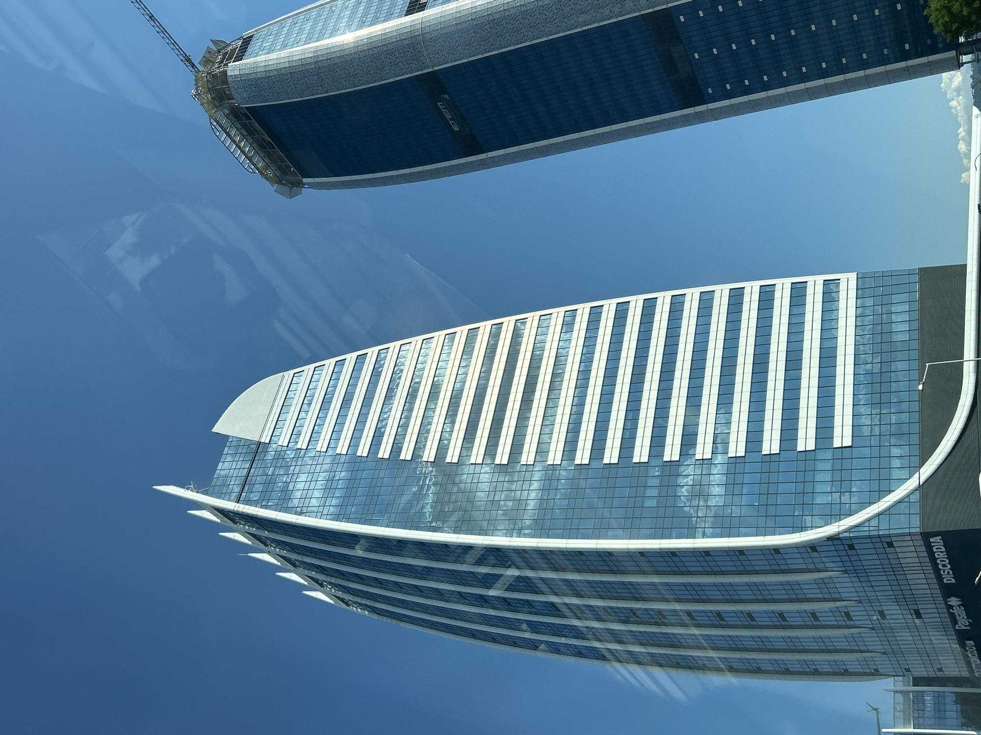 Modern glass towers photographed from street level in Sofia