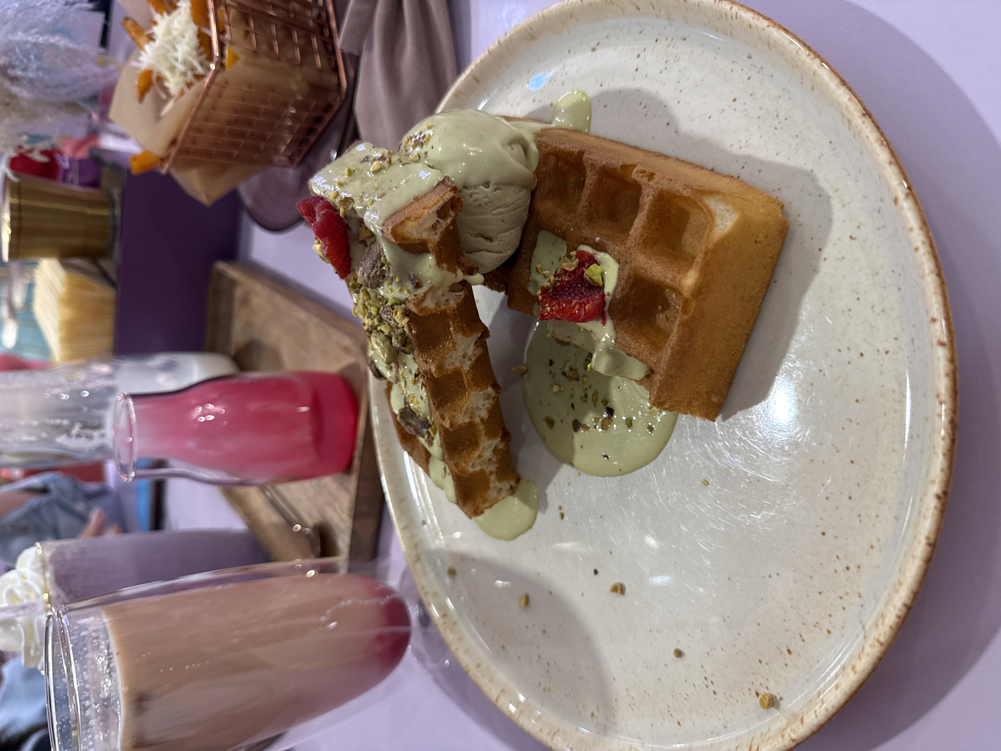 Family shares green pistachio desserts at Vladivostok cafe