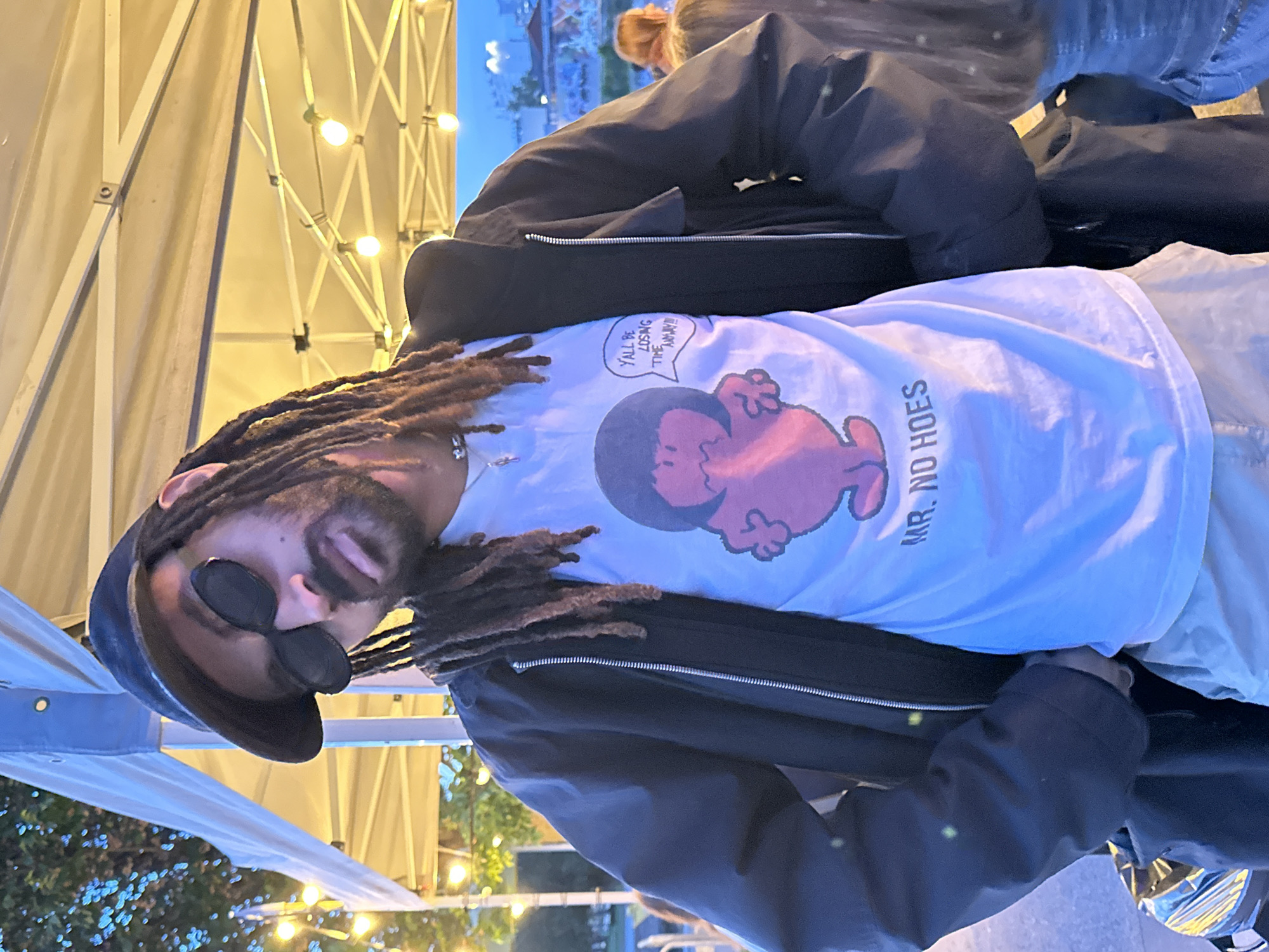 Festival attendee spotted at outdoor Paris event under tent