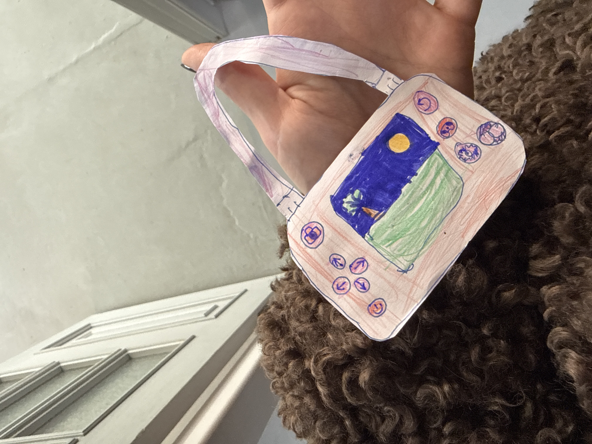 Child's craft and cushion documented in Krasnoyarsk home