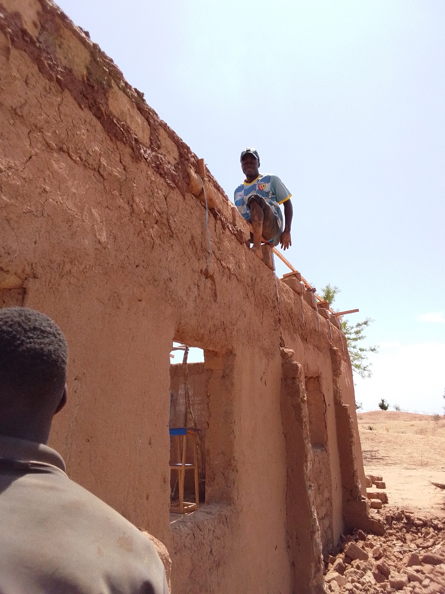 Traditional mud construction underway in northern Nigerian village