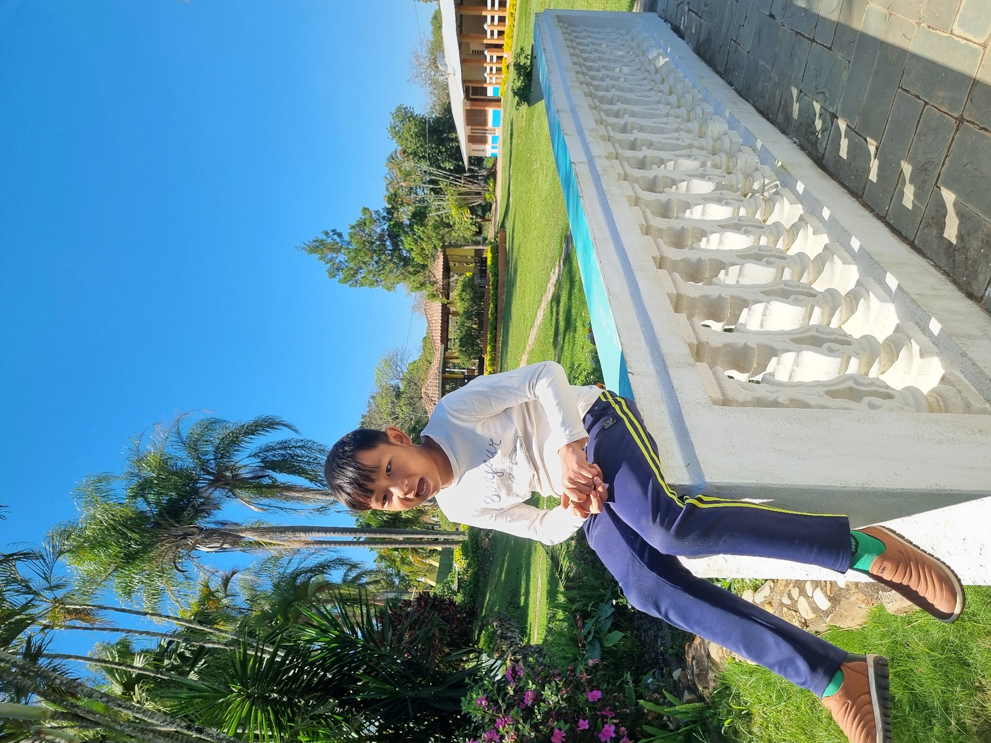 Afternoon stroll through an ornamental garden in Laranjal Paulista