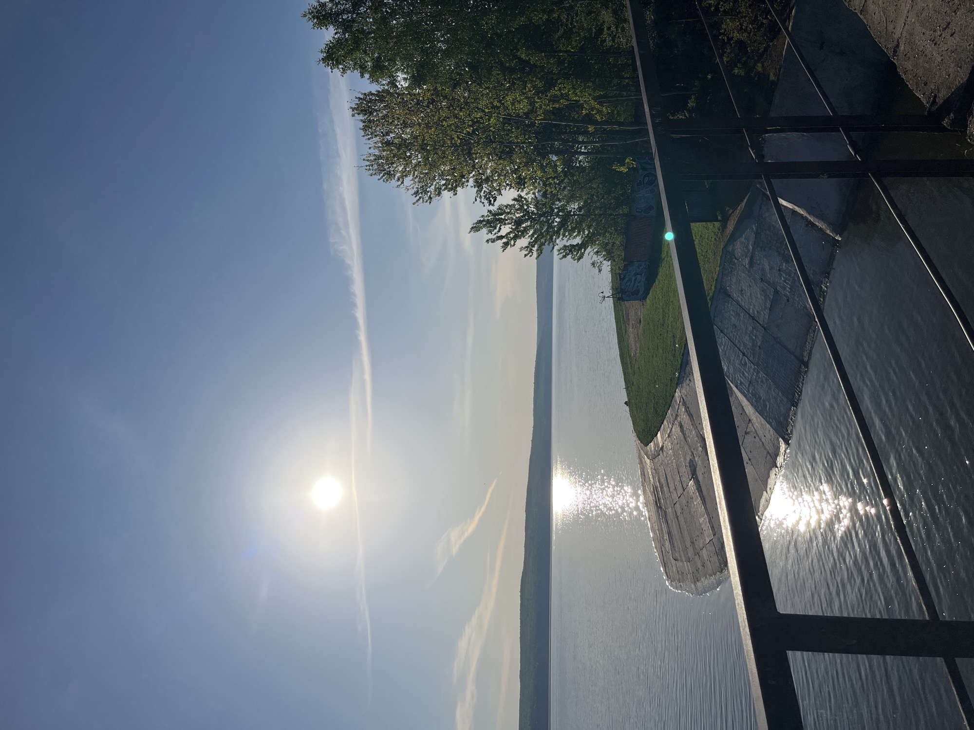 Cyclist and boaters enjoy sunny morning on Kama River