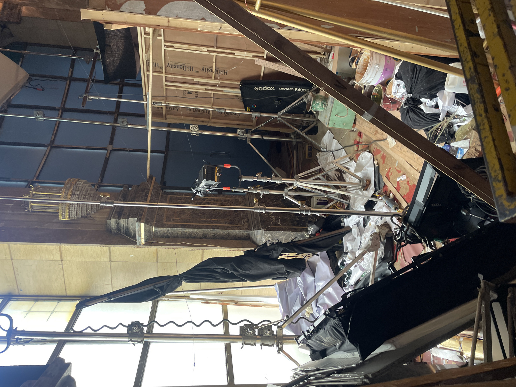 Inside a dressed Mumbai film set with chandeliers and flowers