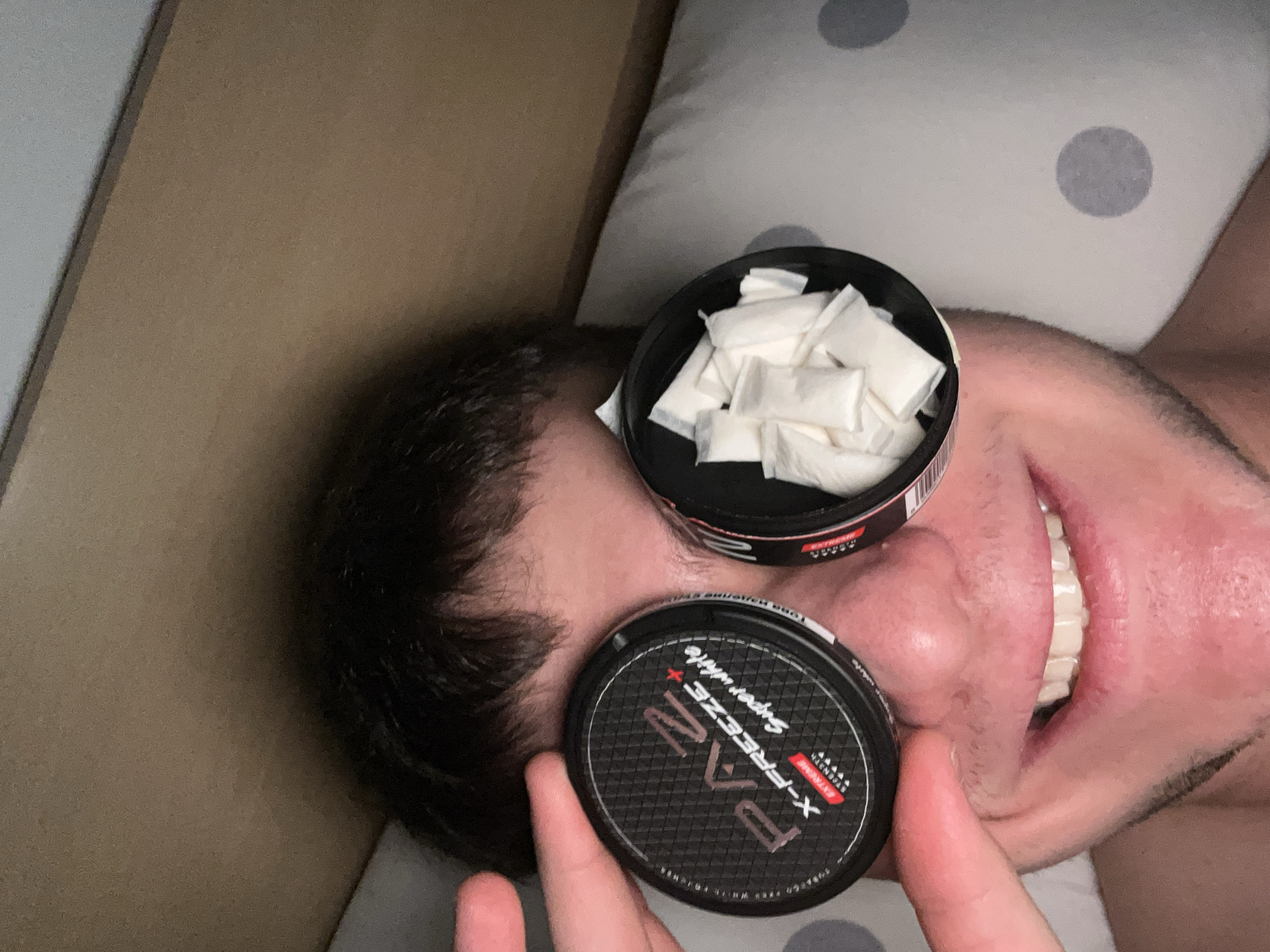 Person photographed in bed with tobacco product in Sofia