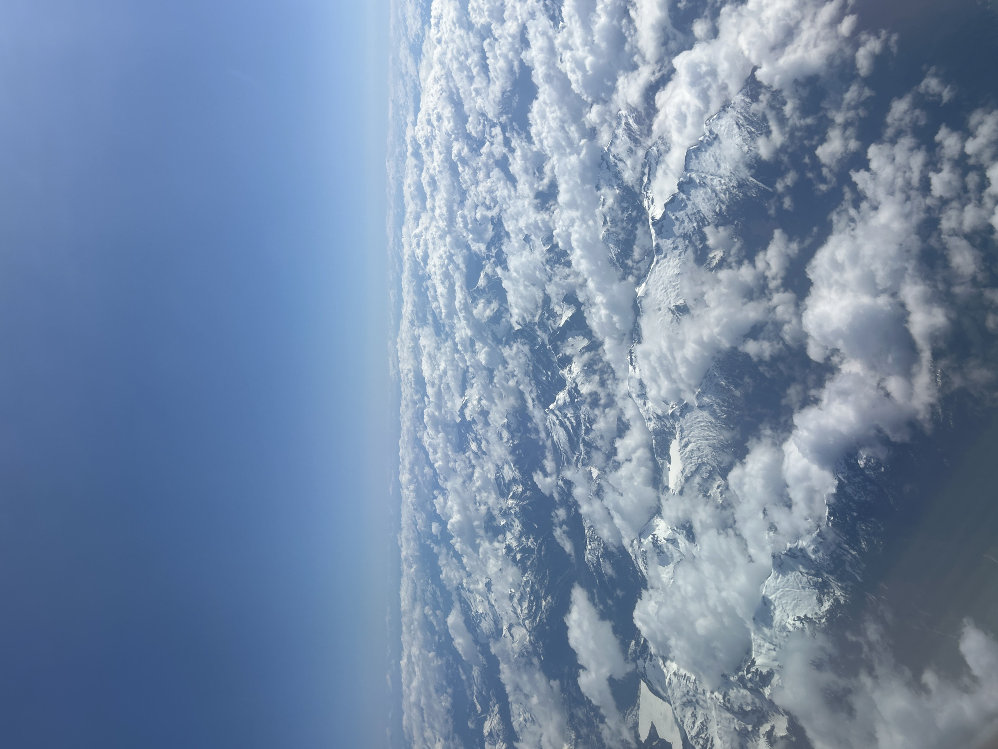 Aerial views capture clouds over Kelowna mountains