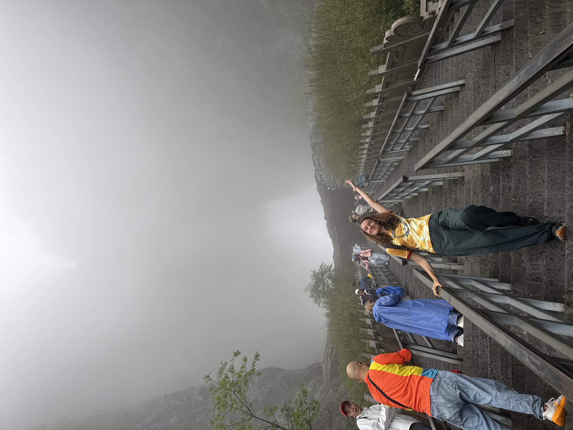 Foggy morning brings tourists to Zhangjiajie mountain trails