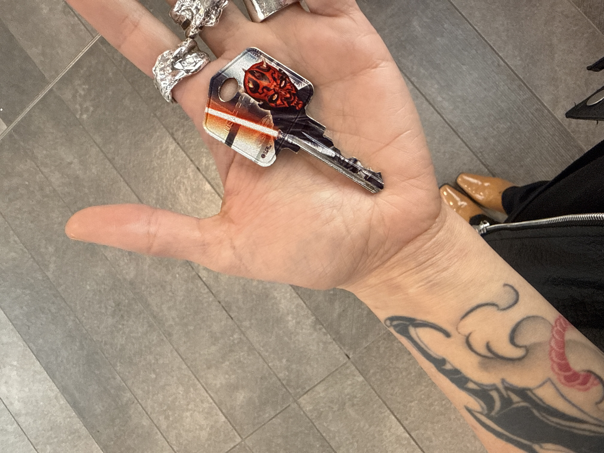 Person browses decorative key collection in North Vancouver store