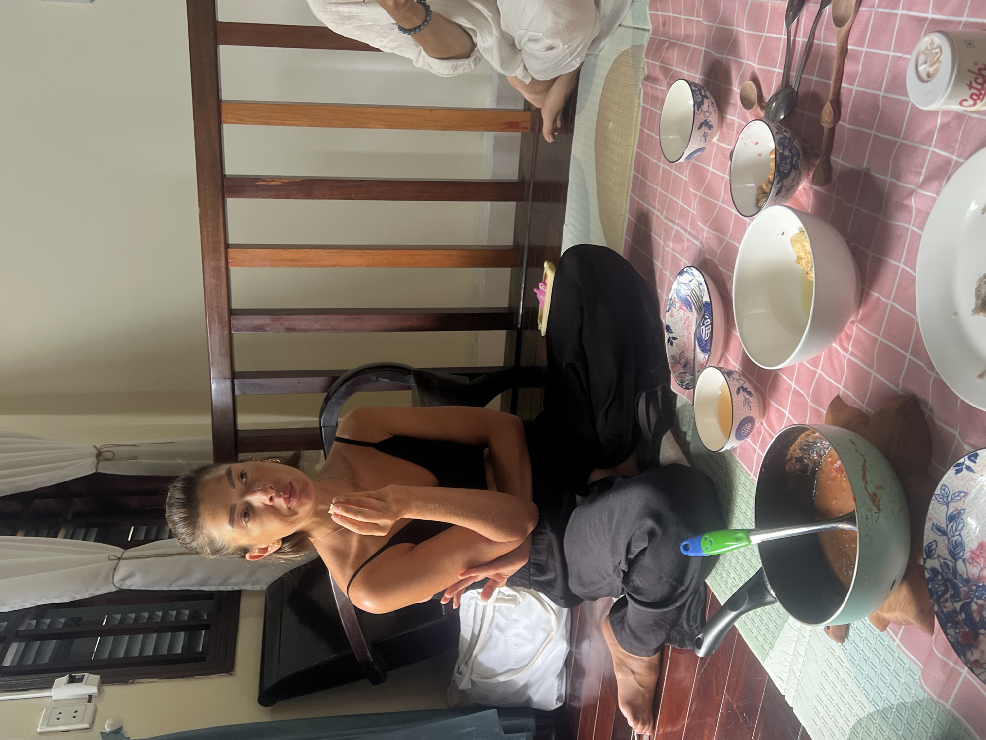 Casual floor meal shared indoors in Da Nang, Vietnam