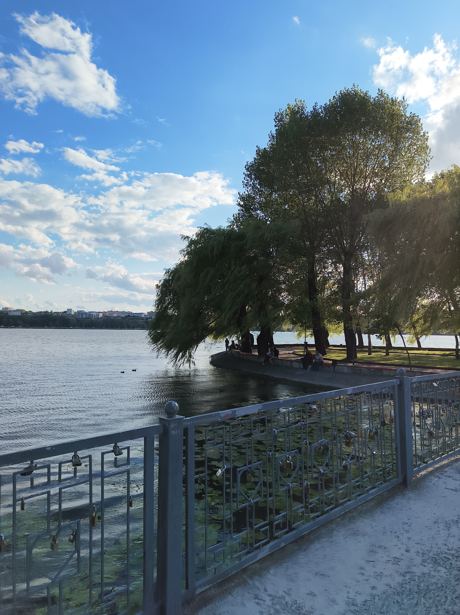 Sunny afternoon along Ternopil Pond's promenade and waterfront
