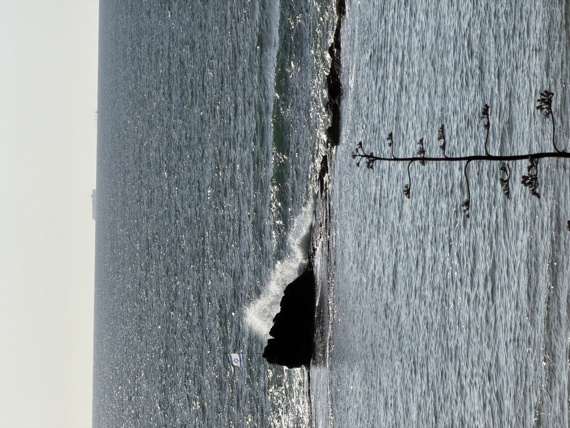 Choppy seas and rocky coastline observed in Bat Yam