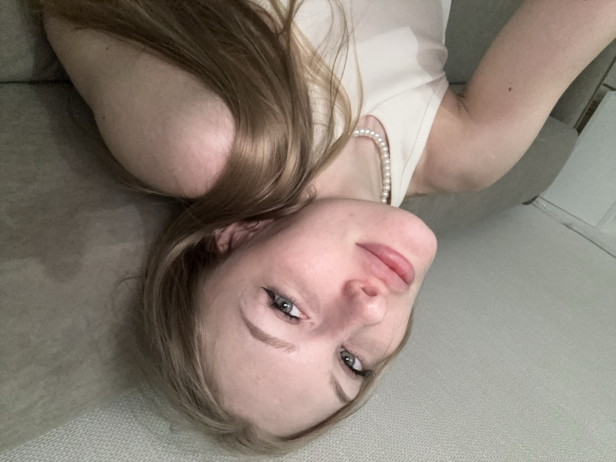 Woman documents selfie session in bedroom, Perm Russia