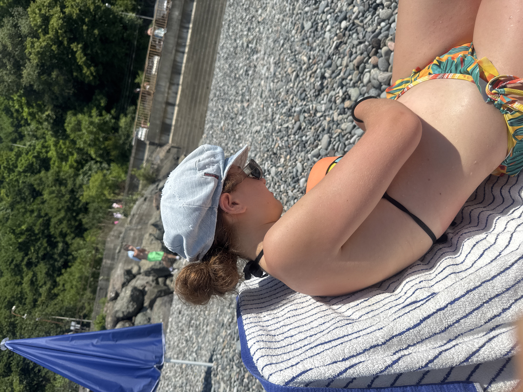 Lazy afternoon on the pebble beach in Sarpi, Georgia