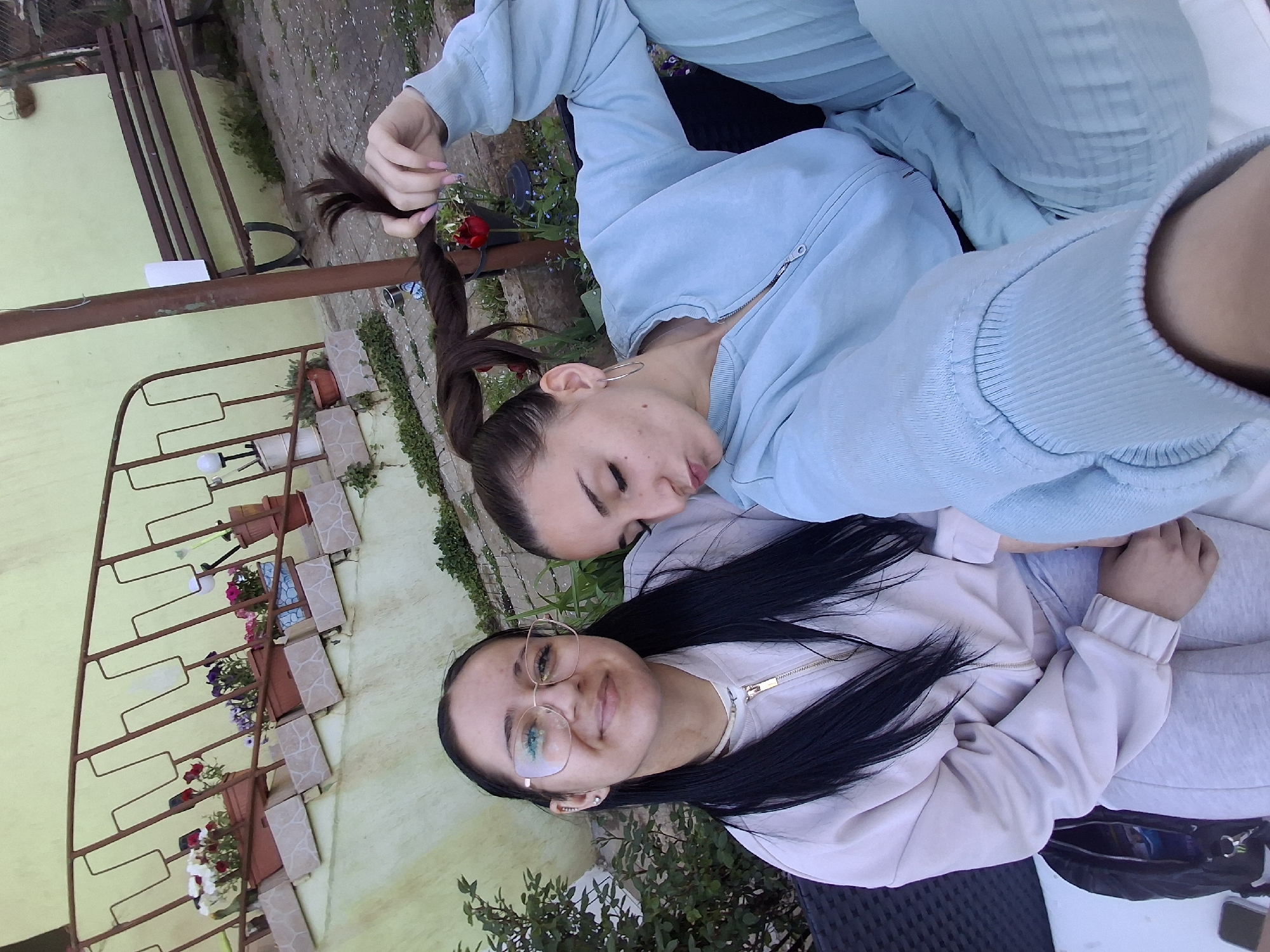 Friends enjoy spring afternoon with drinks and dog in Bulgaria