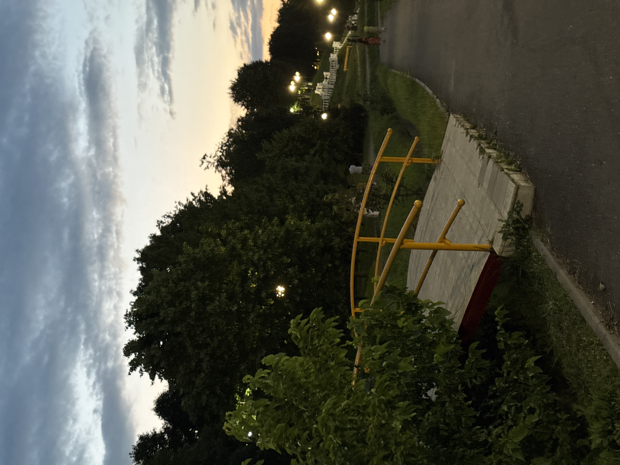 Dusk settles over a Vladikavkaz park at golden hour