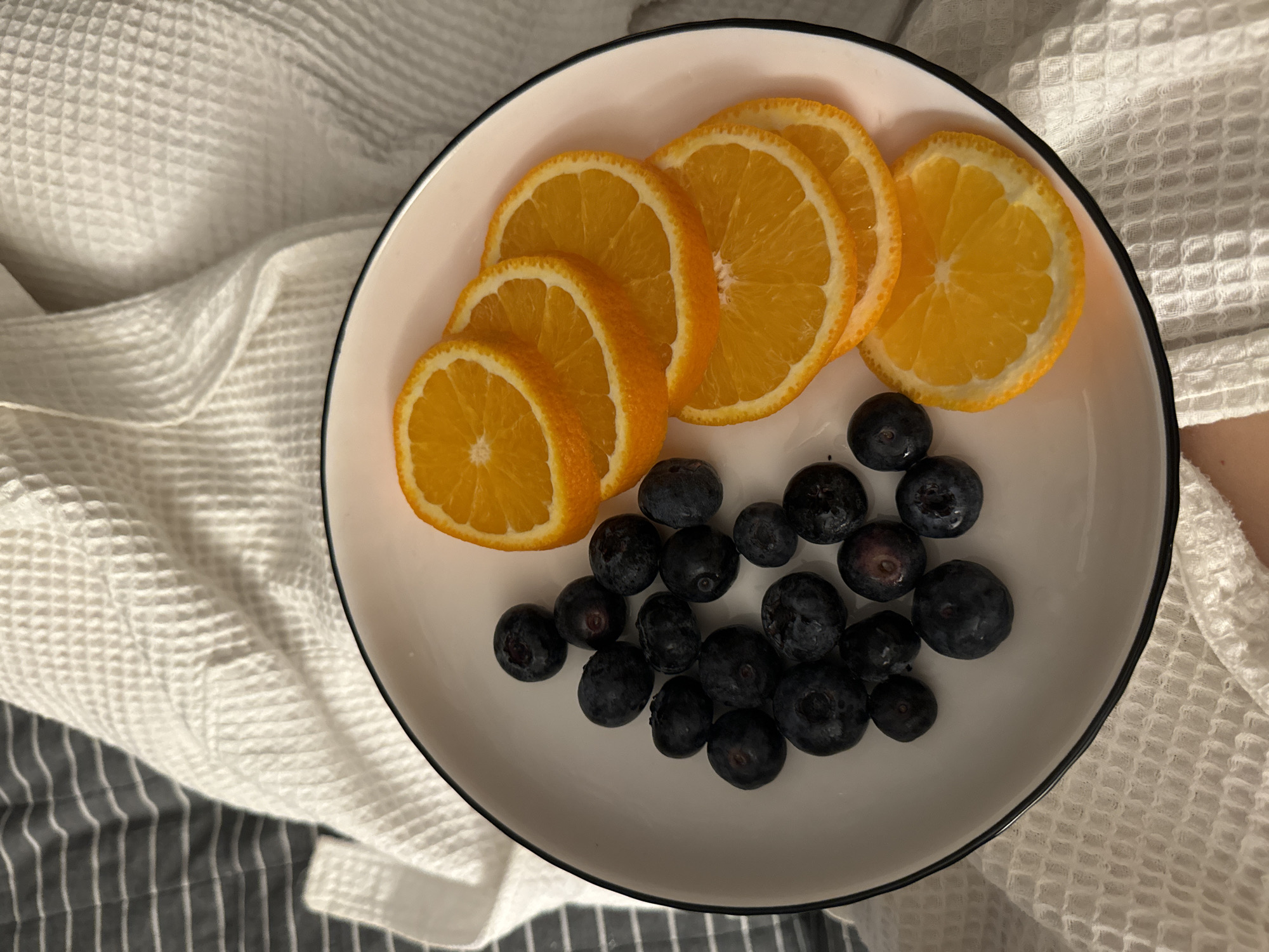 Fresh orange slices arranged on plate in Odintsovo