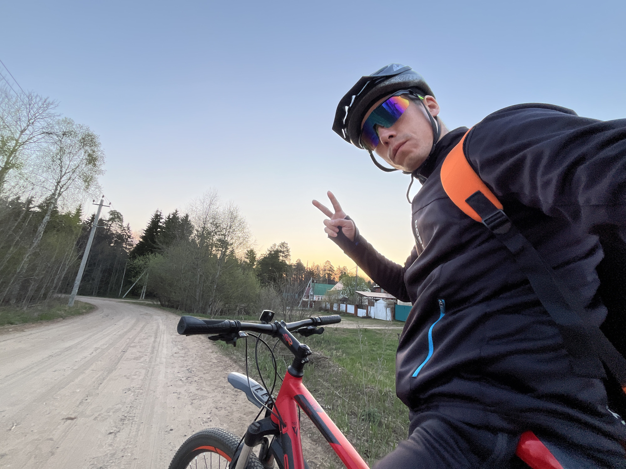 Cyclist takes selfie on dirt road in Chaikovsky
