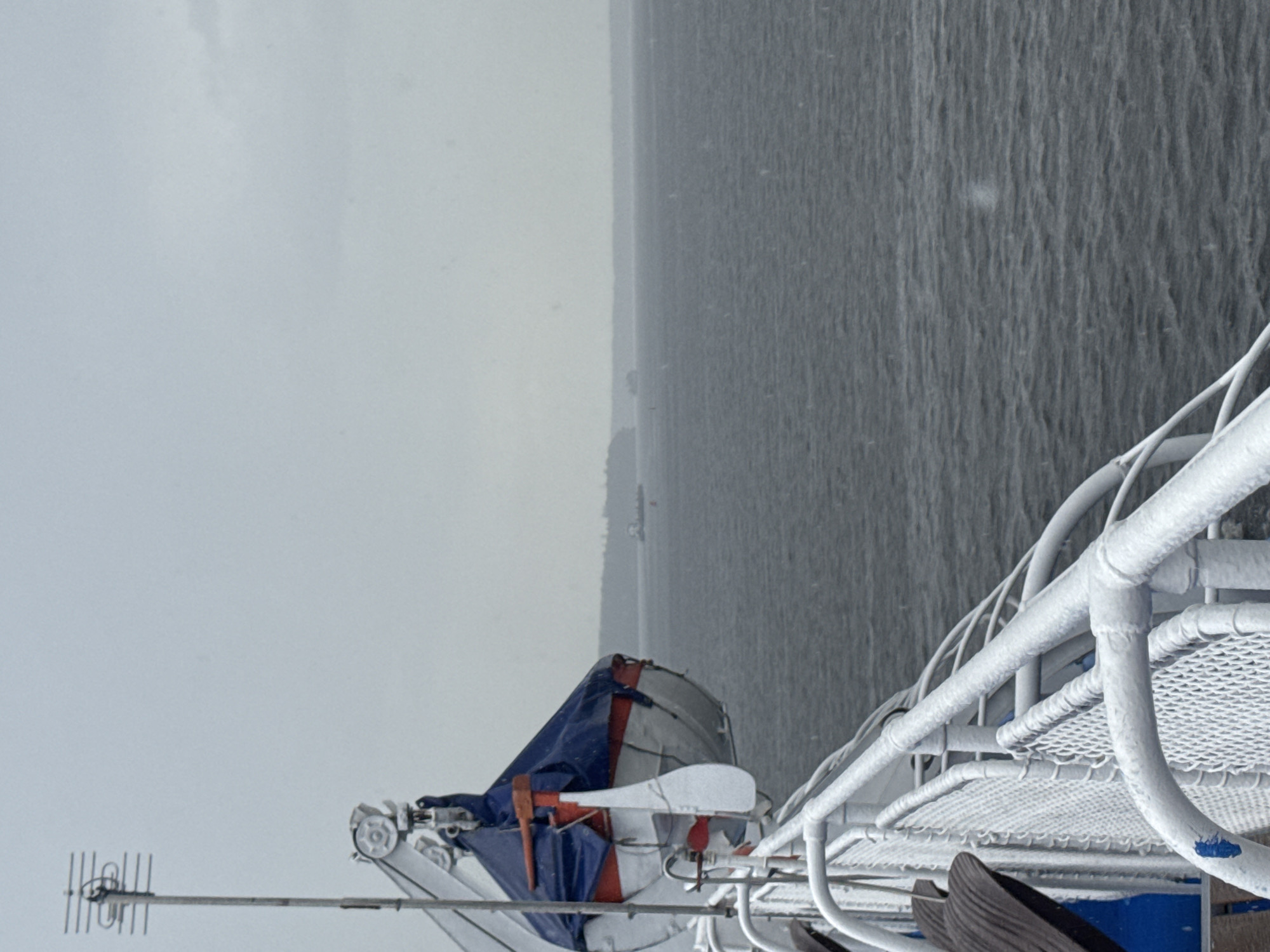 Ferry deck view over grey Russian waters in overcast conditions