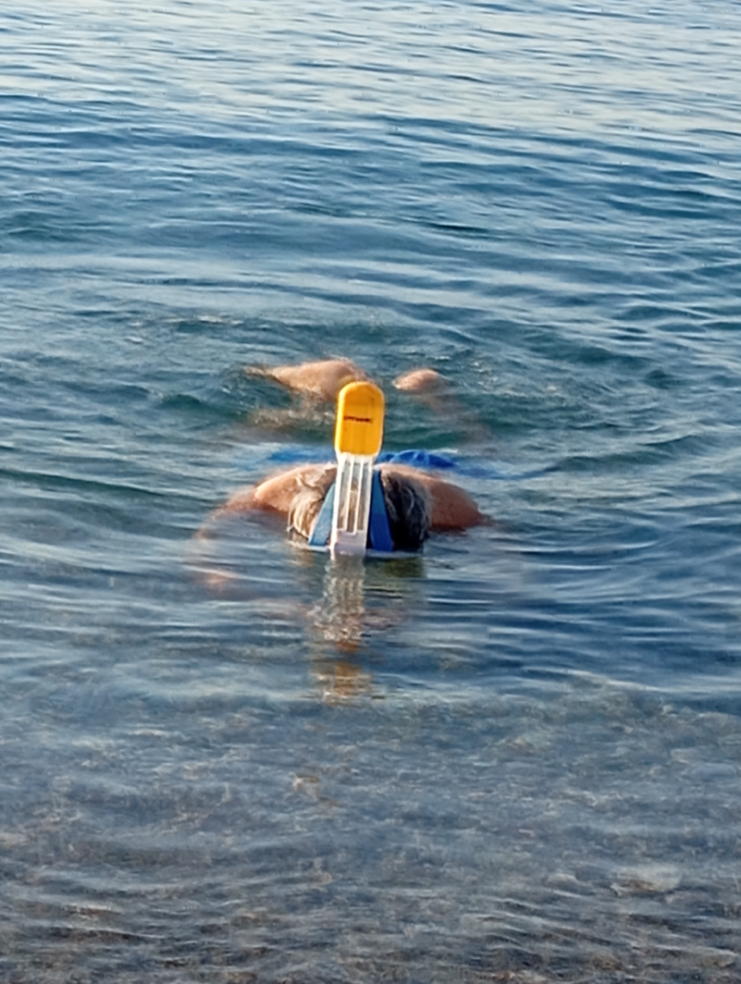 Snorkeling and shoreside rest on Konyaaltı's pebble beach