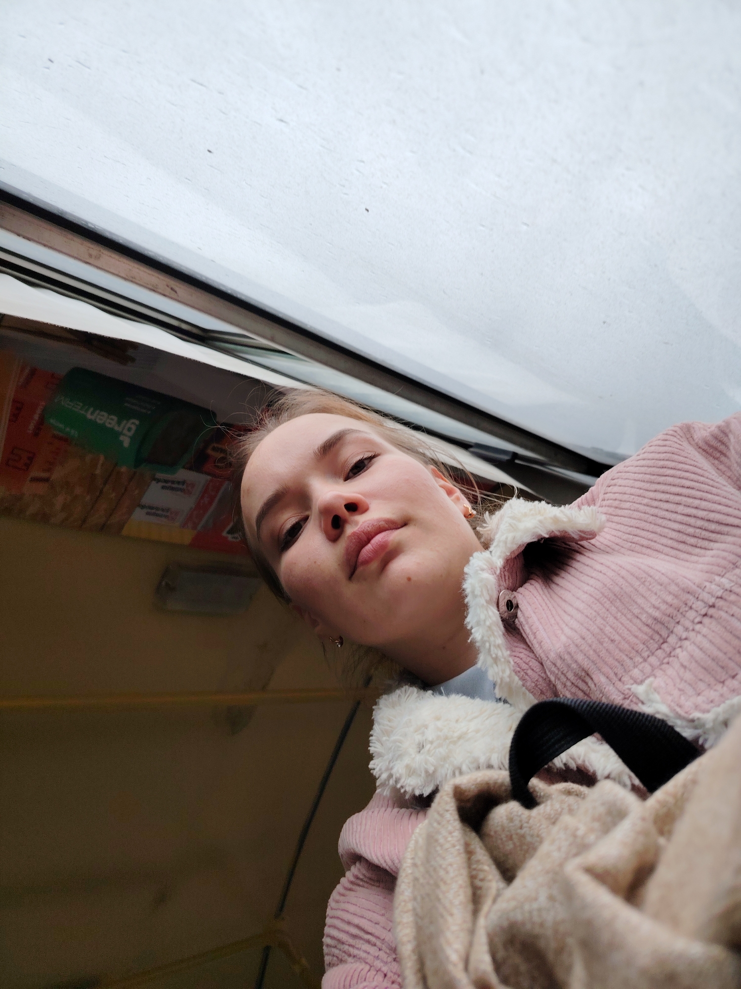 Young woman takes selfie aboard vehicle in Chaikovsky, Russia