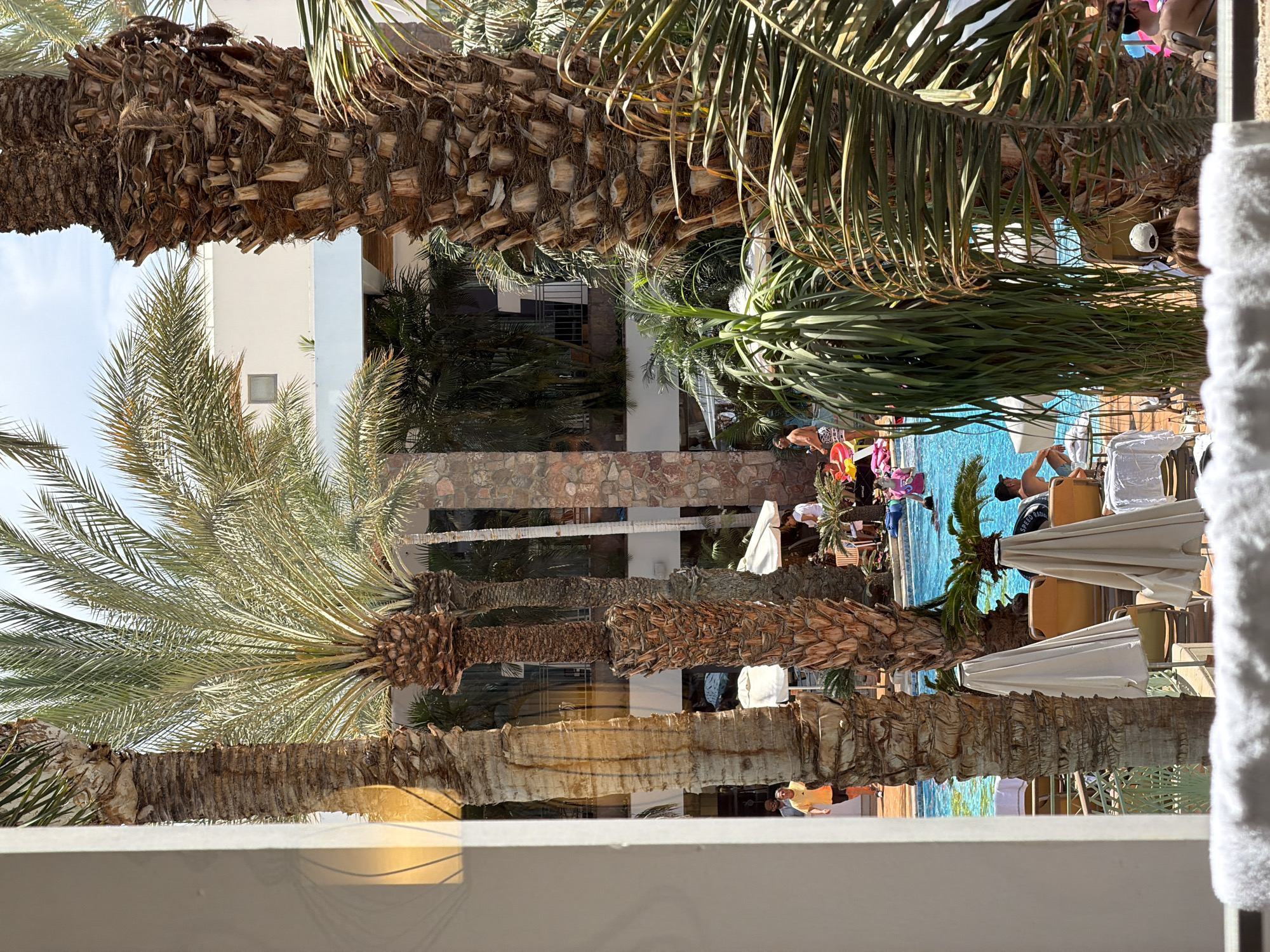 Vacationers enjoy poolside leisure at Eilat resort