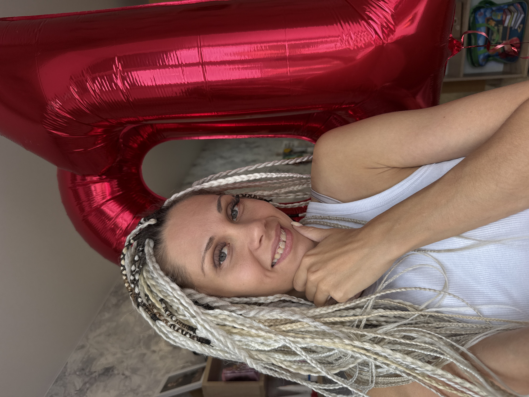 Outdoor birthday celebration with balloon and stroller in Rusanovo