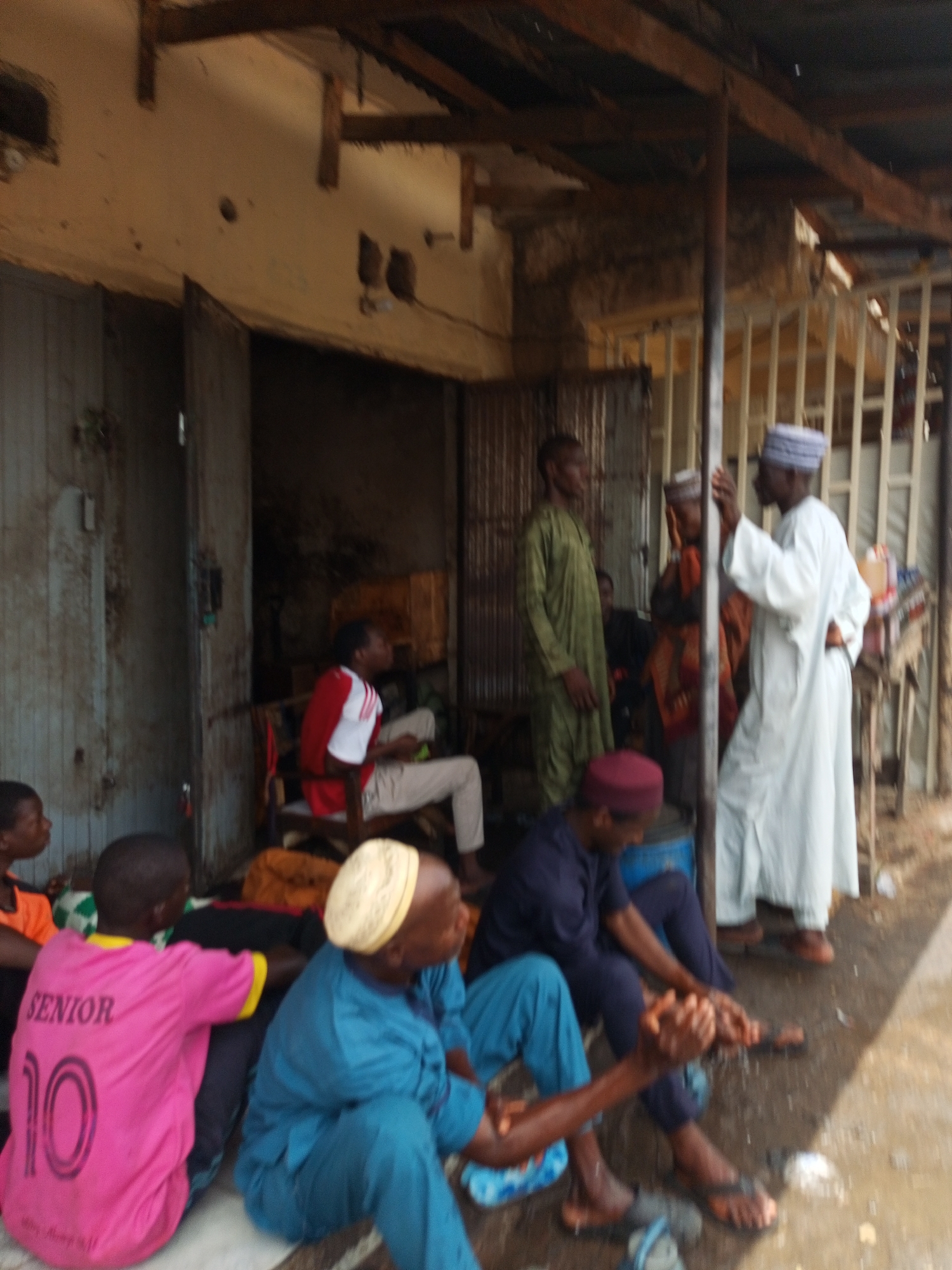 Community gathering outside building in Tempure, Nigeria