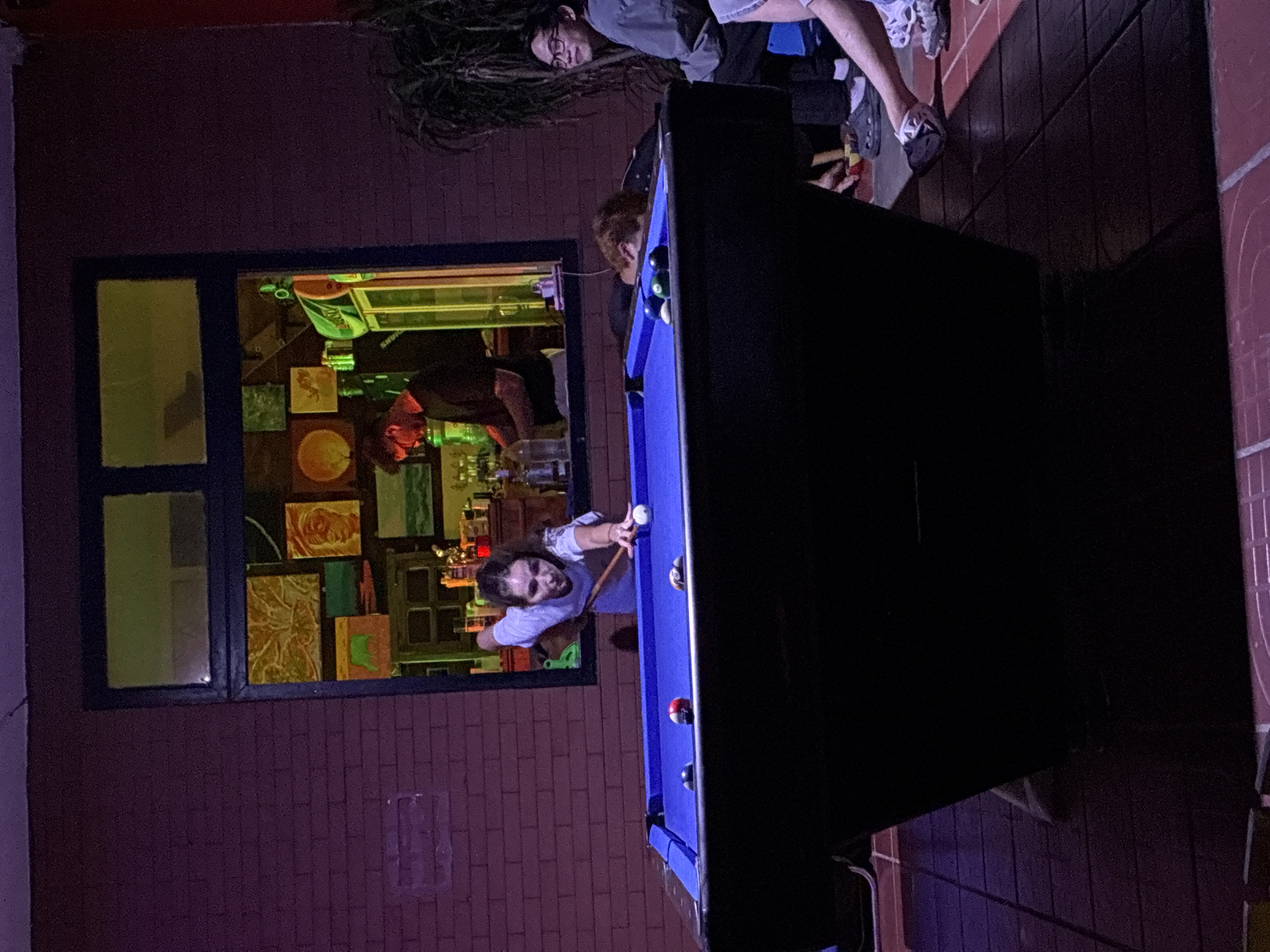Evening social gathering at Da Nang bar features pool games