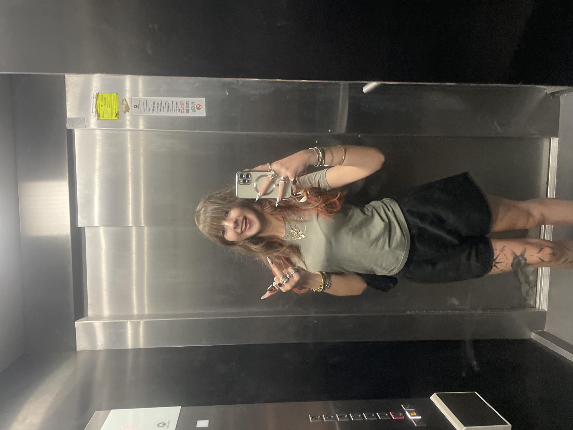 Woman takes elevator mirror selfies in Raanana