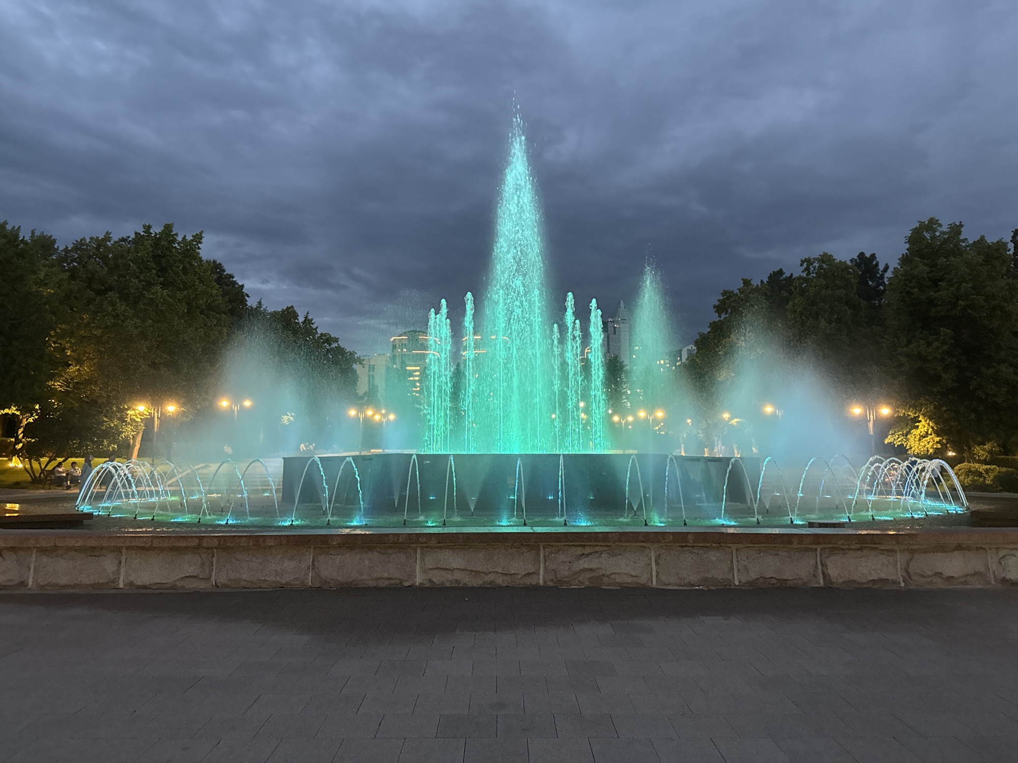Almaty's Singing Fountain lit up at dusk, June 2026
