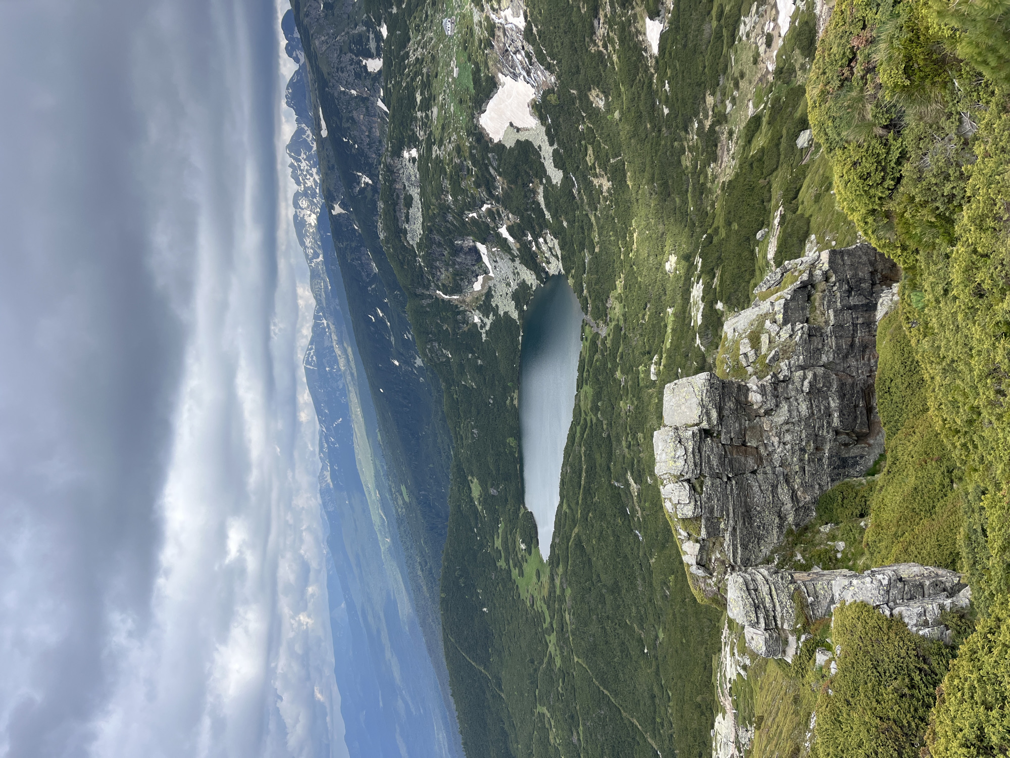 Morning in the Rila Mountains, rocks, lake, and open sky