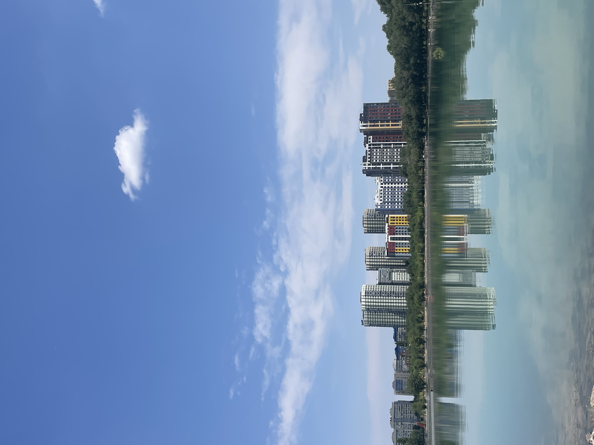 Almaty's lakeside park on a bright summer morning