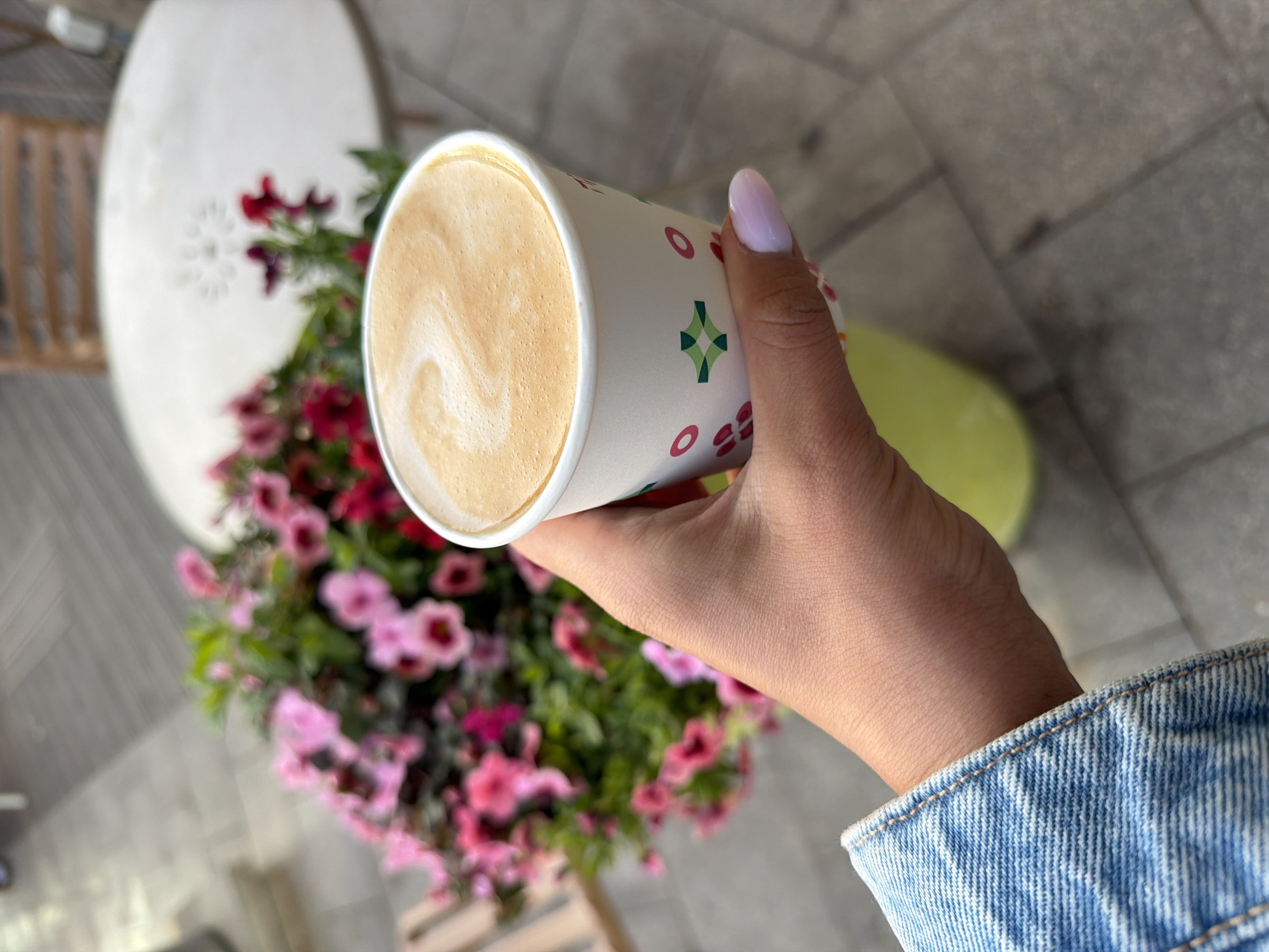 Coffee moment captured with flowers in Tel Aviv