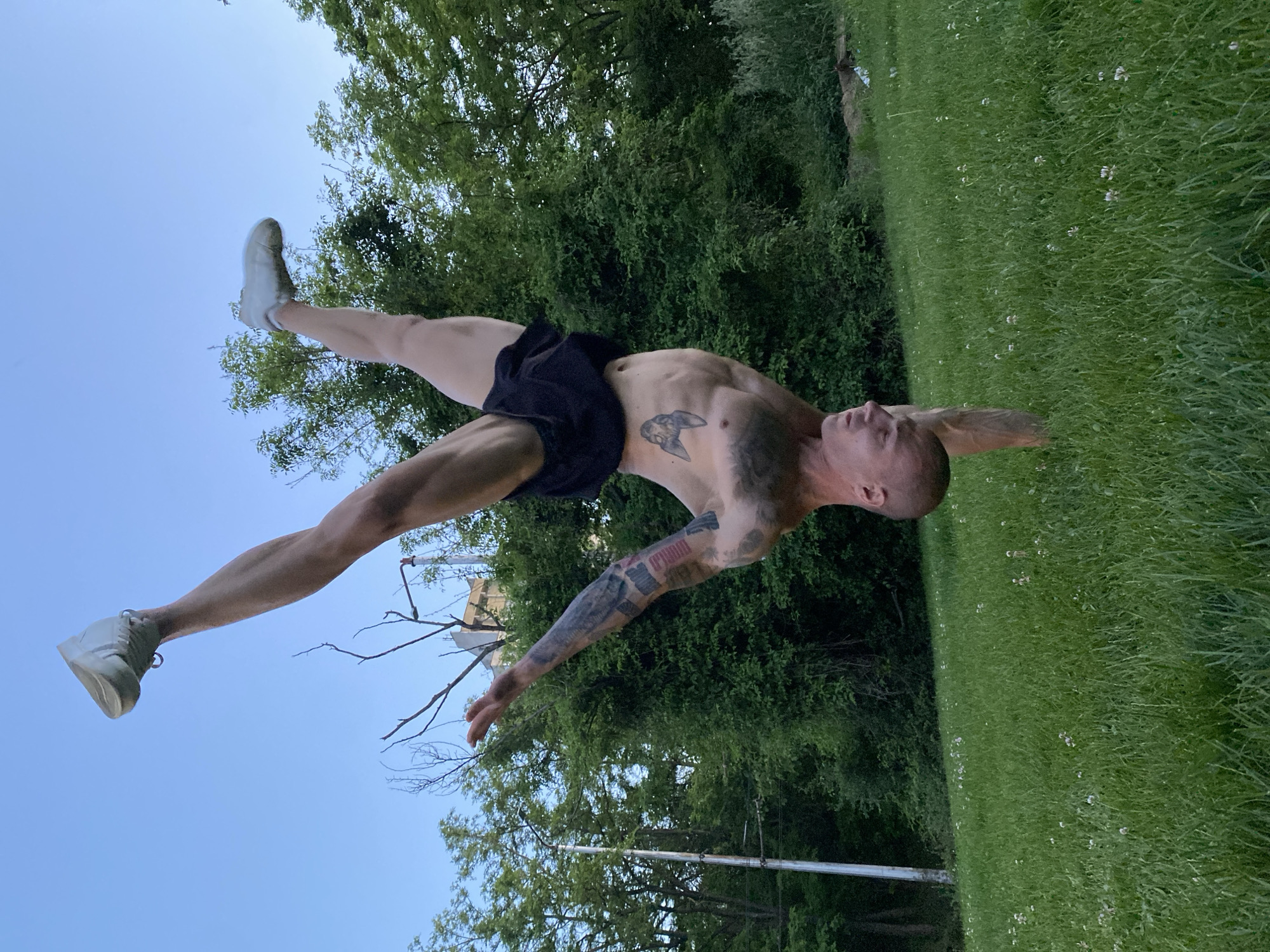 Man performs outdoor calisthenics routine in Pleven park