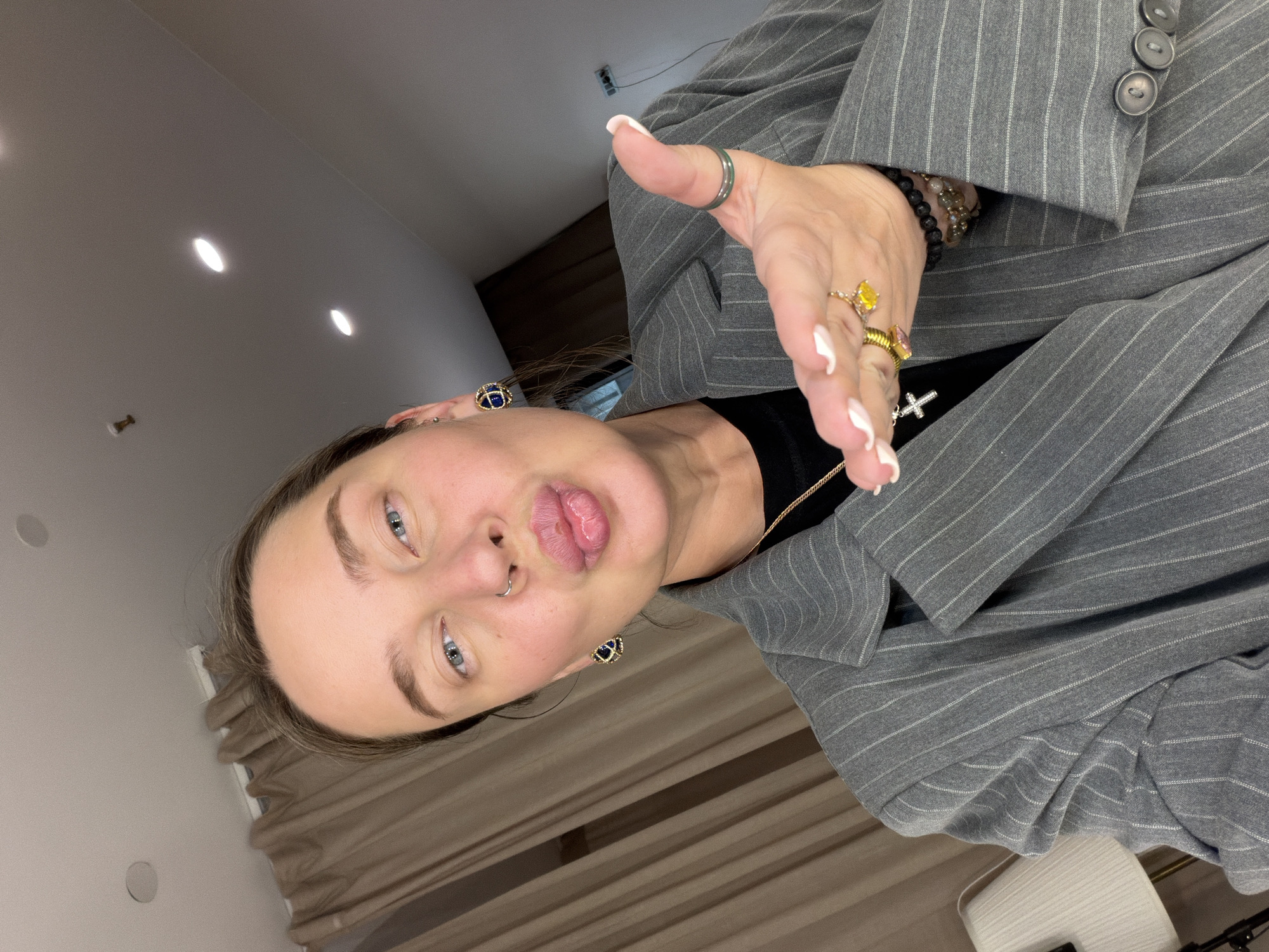 Person takes selfie in pinstripe suit in Khimki