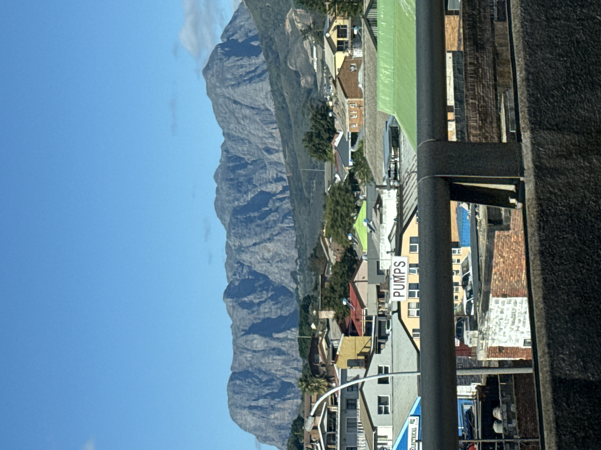 Clear day view of Cloetesville beneath mountain range