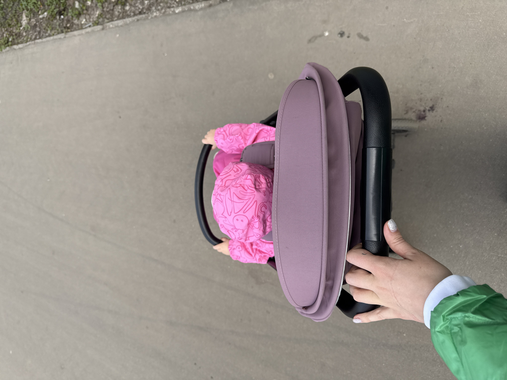 Family stroller walk documented during spring morning in Moscow